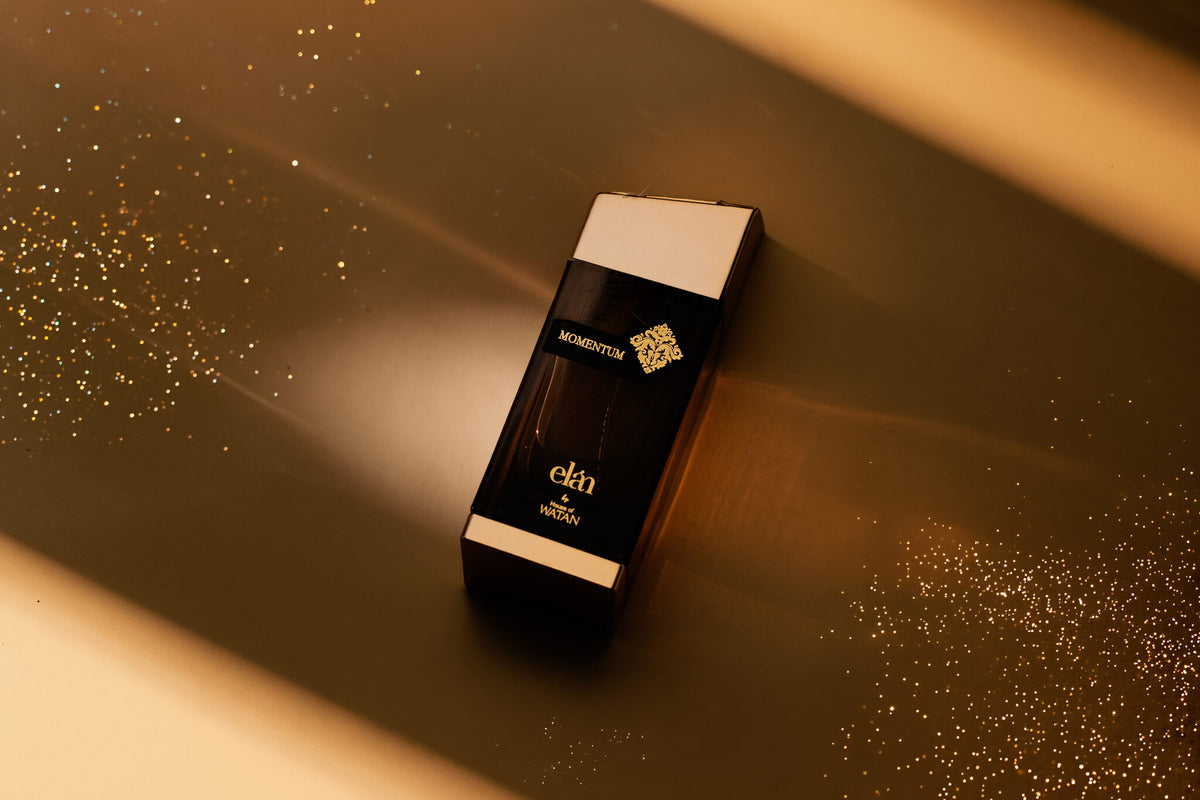 Momentum 100ml bottle flat lay on gold, House of Watan Elan