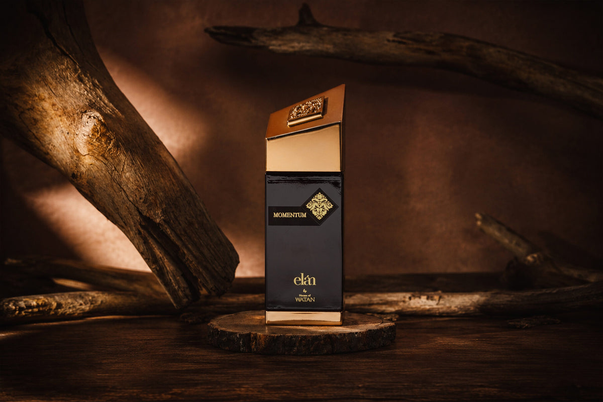 Momentum 100ml bottle and box on driftwood, House of Watan Elan