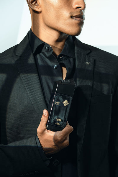 Man holding Nord Bleu by House of Watan, men's fresh blue fragrance