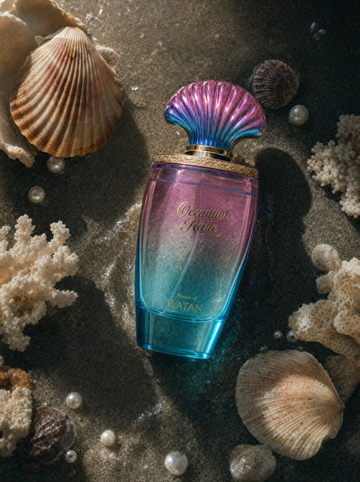 Oceanum Rare perfume on wet sand with seashells, coral and pearls